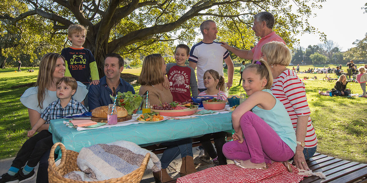Family enjoying picnic table at Centennial Park