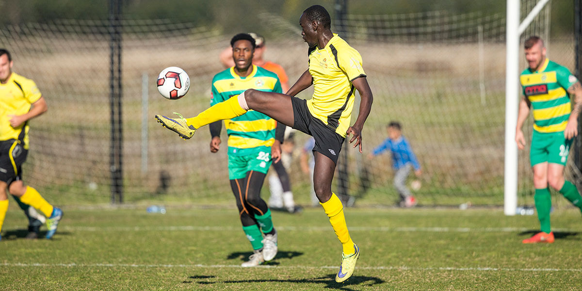 Men playing soccer