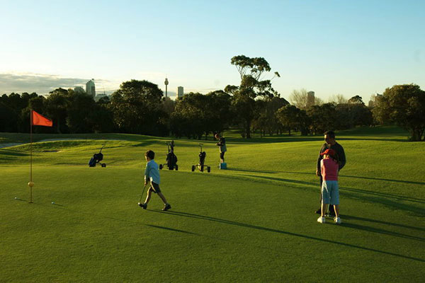 Man and boy playing golf