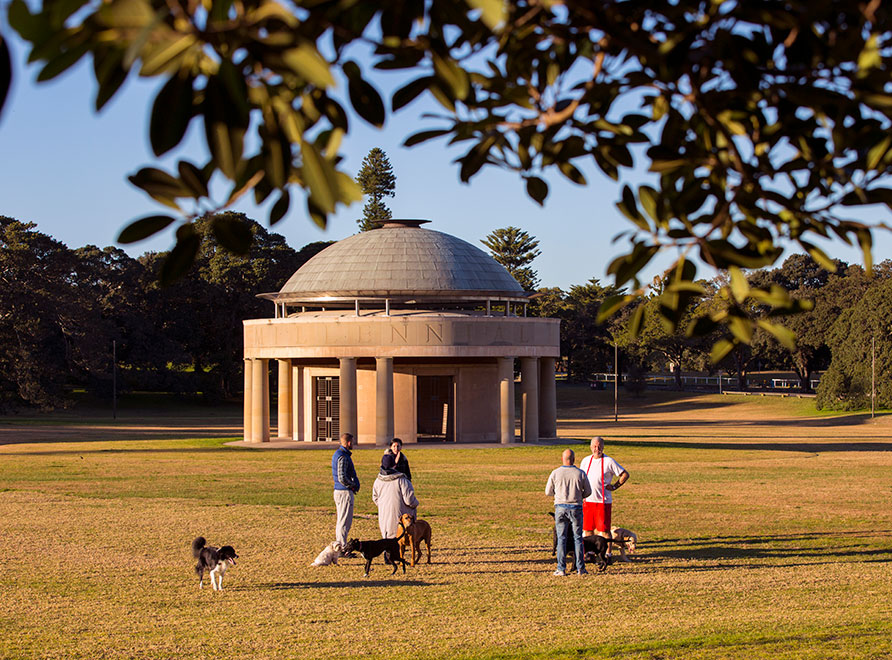 Family enjoying picnic at table in park