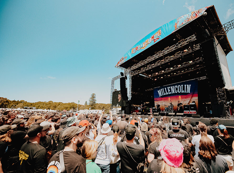 People in front of concert stage in park