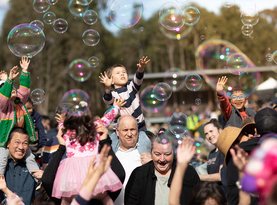 Child playing with bubbles.