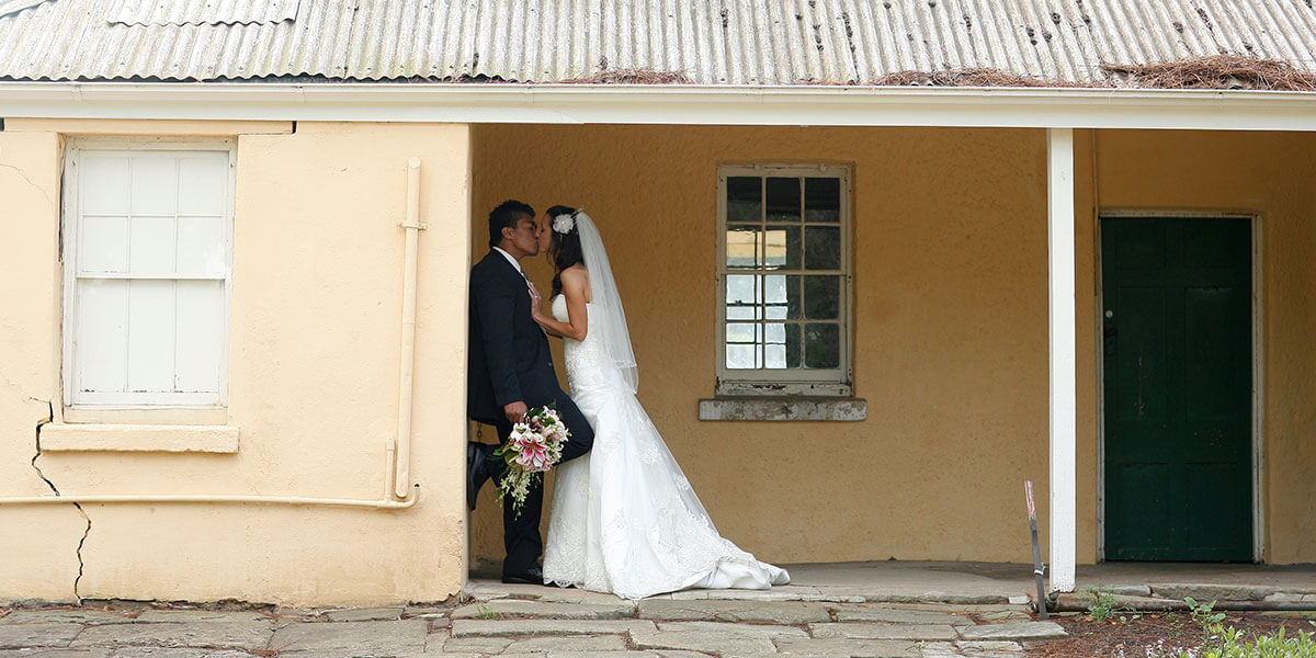 Couple kissing in wedding photo