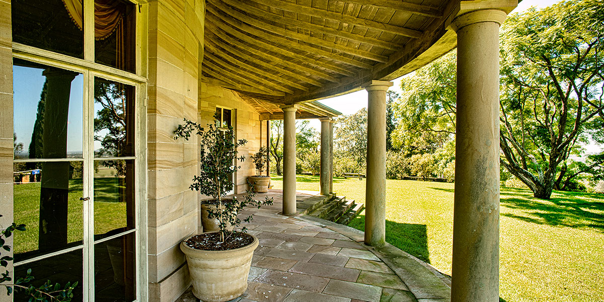 View of heritage building from veranda to bushland park