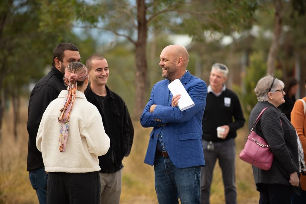 Greater Sydney Parklands staff and chief executive meet in a bushland setting