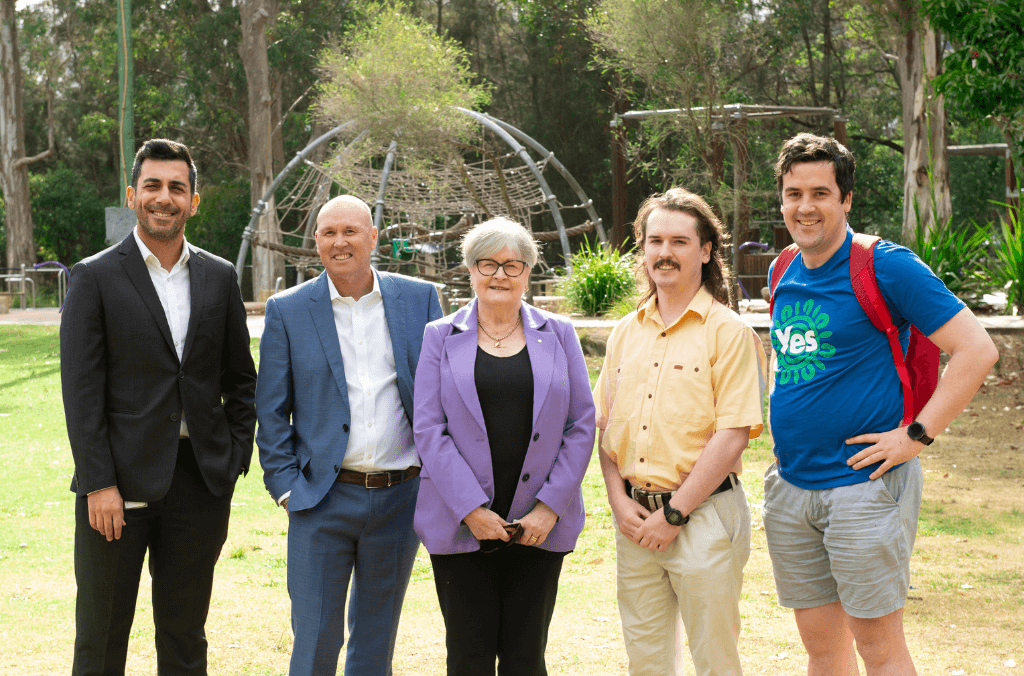 Parramatta Park community trustee board members stand side by side at Paperbark playground