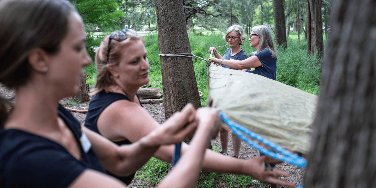 People participating in the building a shelter program.