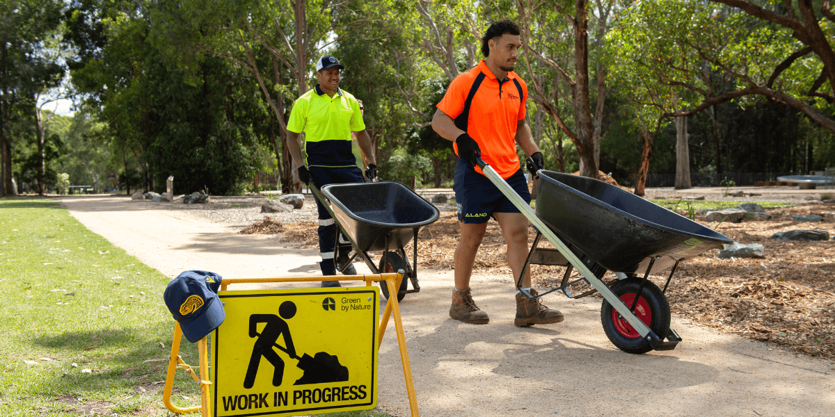 Parramatta Eels team members volunteering at Parramatta Park.