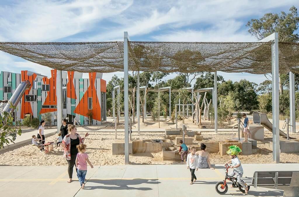 A group of children playing together at Bungarribee playground.