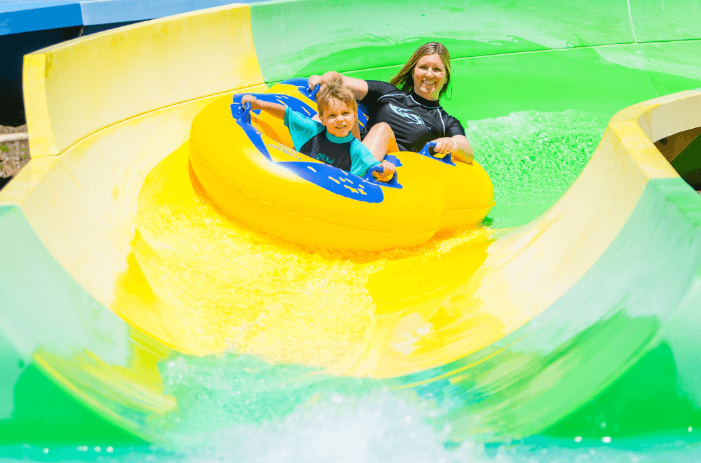 Woman and boy on a slide at Raging Waters.