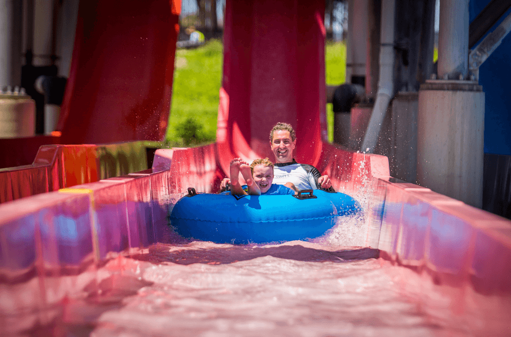 Man and boy enjoying their time at Raging Waters.